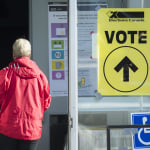 People arrive to cast their ballots at a polling station on federal election day in Shawinigan, Que., on Oct. 21, 2019 (CP/Graham Hughes)
